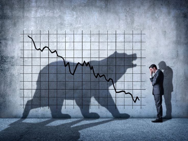 Stock market crash, declining graph, casting a shadow of a roaring bear. A worried businessman in a suit stands nearby, holding his head in distress, symbolizing fear